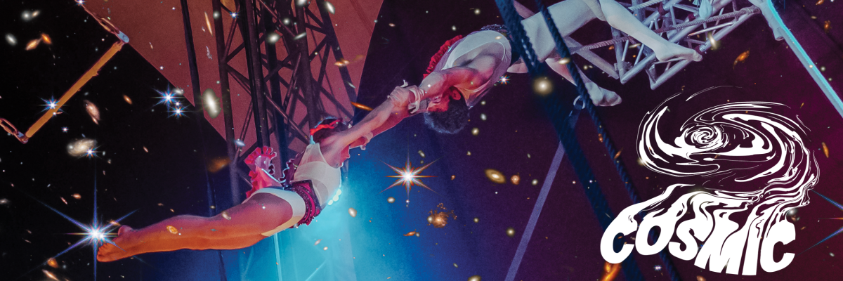 Two FSU students swing through the air on the Flying Trapeze