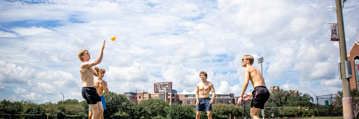 Students playing Spikeball on the Main Campus Fields