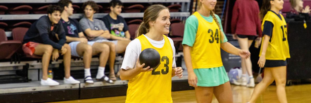 Student playing Intramural Dodgeball in Tully Gym