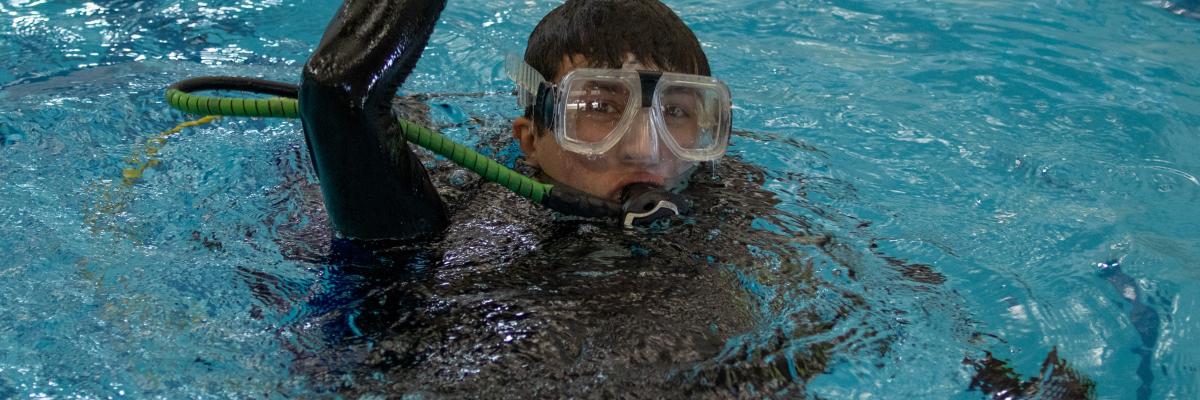 student taking scuba diving course with FSU Campus Recreation