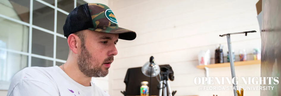 Artist Noah Verrier painting a photo