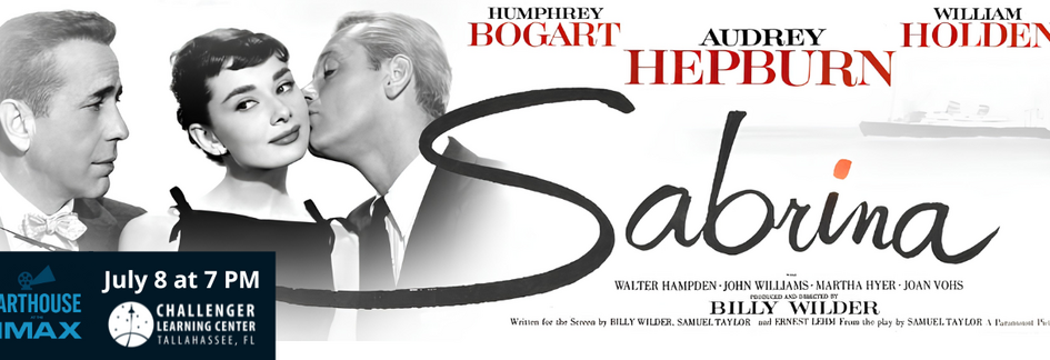 A banner for the film Sabrina featuring Humphrey Bogart on the left, Audrey Hepburn in the center, and William Holden on the right leaning in to kiss her cheek. The title ‘Sabrina’ appears in elegant script across the middle, with cast and production credits below. A blue box on the left advertises an Arthouse IMAX screening on July 8 at 7 PM at the Challenger Learning Center in Tallahassee, FL.