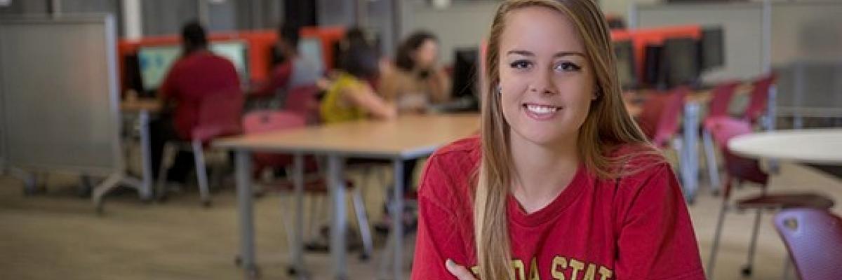 FSU Student smiling because her computer is fixed.