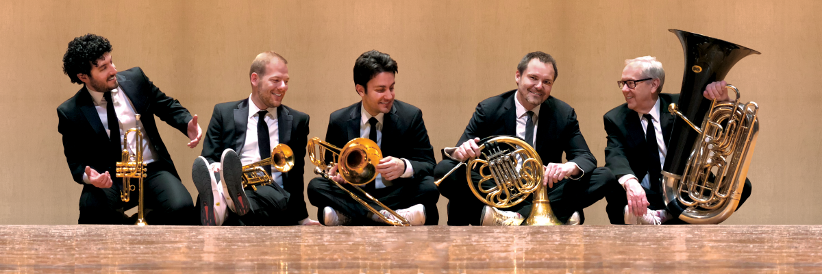 Canadian Brass sits with their instruments
