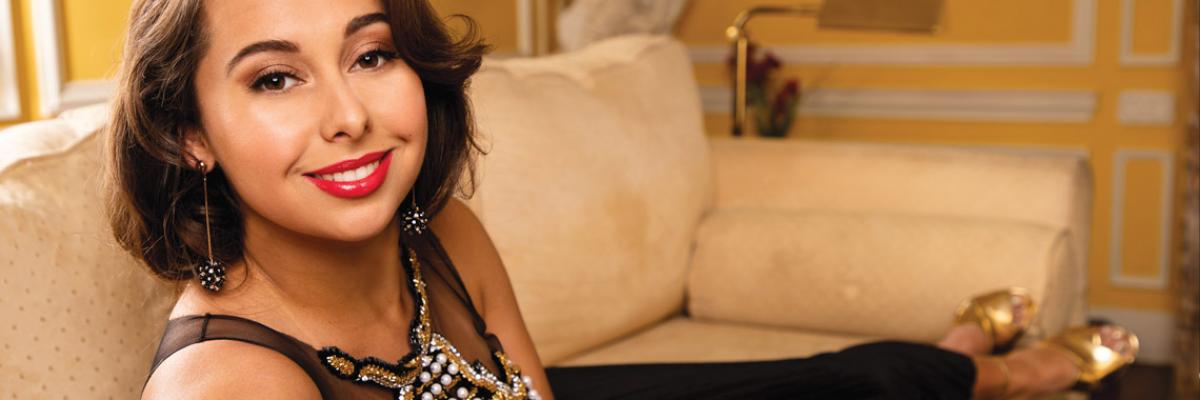 Veronica Swift lays on a couch