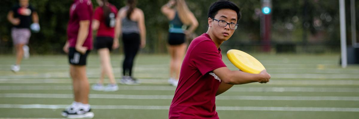 Student getting ready to throw frisbee