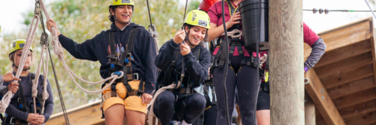 Group of people on the High Ropes Course at FSU Reservation Lakefront Park