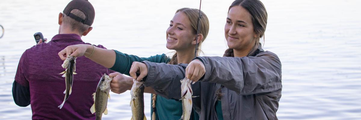 Students participating in a fishing tournament at the FSU Lakefront Park