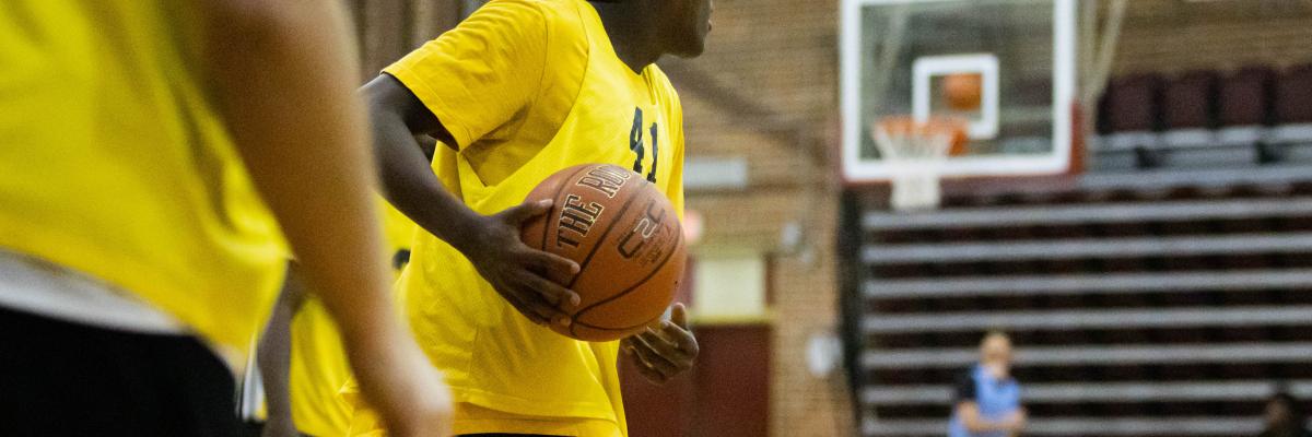 Student playing intramural basketball